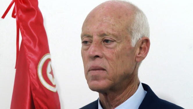Kais Saied, a constitutional law professor without a party, stands after hearing the unofficial results of the presidential elections, Sunday, Sept.15, 2019. A jailed media magnate and an independent outsider appeared likely to face off in Tunisia's presidential runoff, after a roller coaster first-round race in the country that unleashed the Arab Spring pro-democracy uprisings. (Photo/Str)