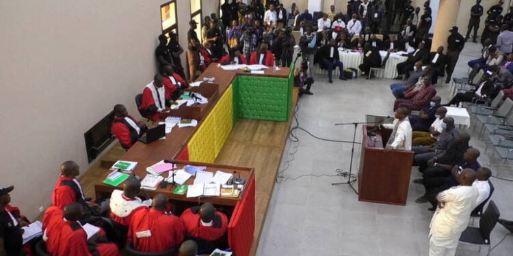 Guinea's former President Moussa Dadis Camara, who is accused of responsibility for the 2009 massacre and mass rape of pro-democracy protesters by forces linked to a former military junta, talks during his trial in Conakry, Guinea September 28, 2022. REUTERS/Souleymane Camara
